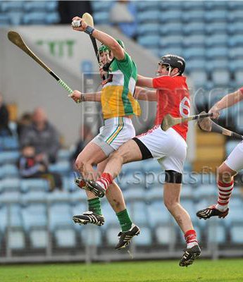 2011-02-13 Joe Bergin (Offaly) beats Mark Ellis to the ball in the NHL game between Cork & Offaly