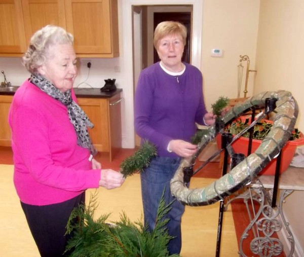 Dedicated and wonderfully creative members of Millstreet Altar Society - Kitty Cronin of The Rectory and Teresa Kelleher of Liscahane prepare this  year's Advent Wreath to have it ready for the First Sunday in Advent.  Click on the image to enlarge.  (S.R.)