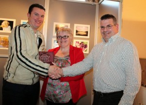 2014-05  John F Kelleher won Best Flower Photography at Bealtaine Festival receiving his award from Justin Black