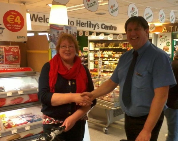 2014-06-07 Eileen Kelleher of Dromsicane, receives her prize of a bike from Greg Kuderski, Manager, Herlihy's Centry