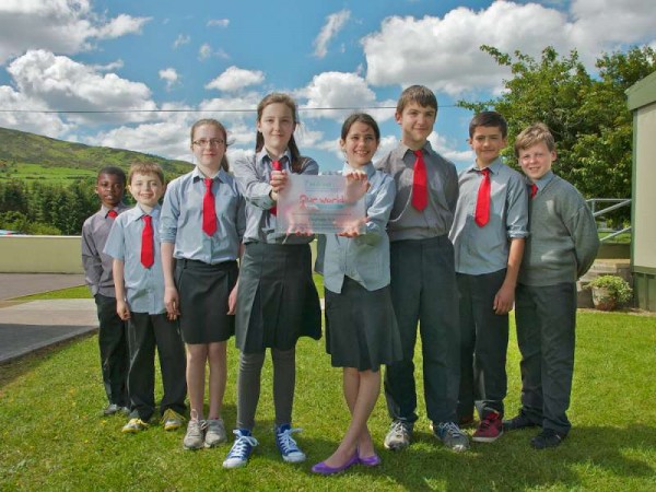 "Cloghoula N.S. pupils displaying the plaque , won for excellence in global awareness at the regional Our World Irish Aid Awards ceremony held in Cork recently." Photo by Justin of Justborn Photography, West End, Millstreet.