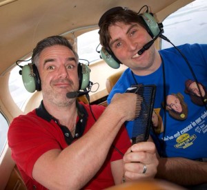 John McGuire (Fat Tony's Barber Shop) preparing for the shave with JP Randles (GFC) in Galway Flying Club's cessna 172