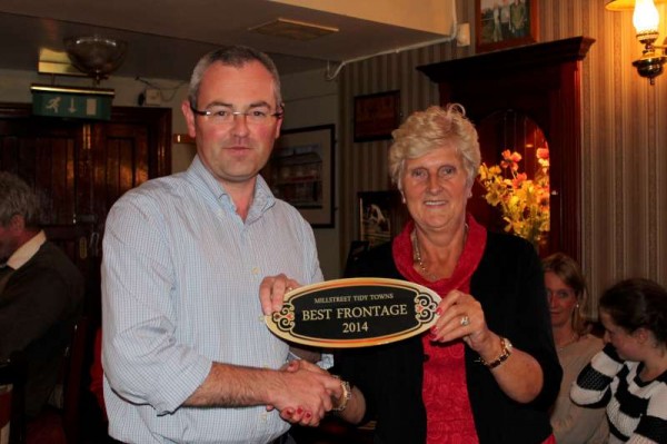 Chairman of Millstreet Tidy Towns Association presents the prestigious Best Frontage Award 2014  to Ursula Pomeroy of "The Clara Inn" at the special Awards Event held in "The Clara Inn" on Wednesday, 1st Oct..  Click on the images to enlarge.  (S.R.)