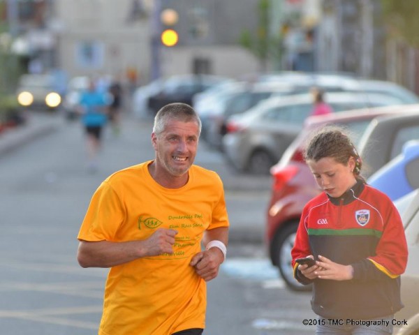 2015-07-29 Clara keeping her Dad on his toes last Friday night at the fun run in kanturk