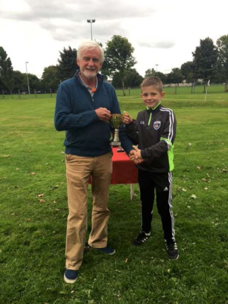 Barry Frazer (chairman of the Pitch and Putt Club) presenting The Sing Trophy to Cian O'connor Station Road